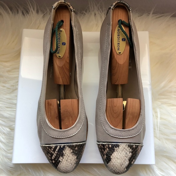 Tan and alligator pattern AGL flats.